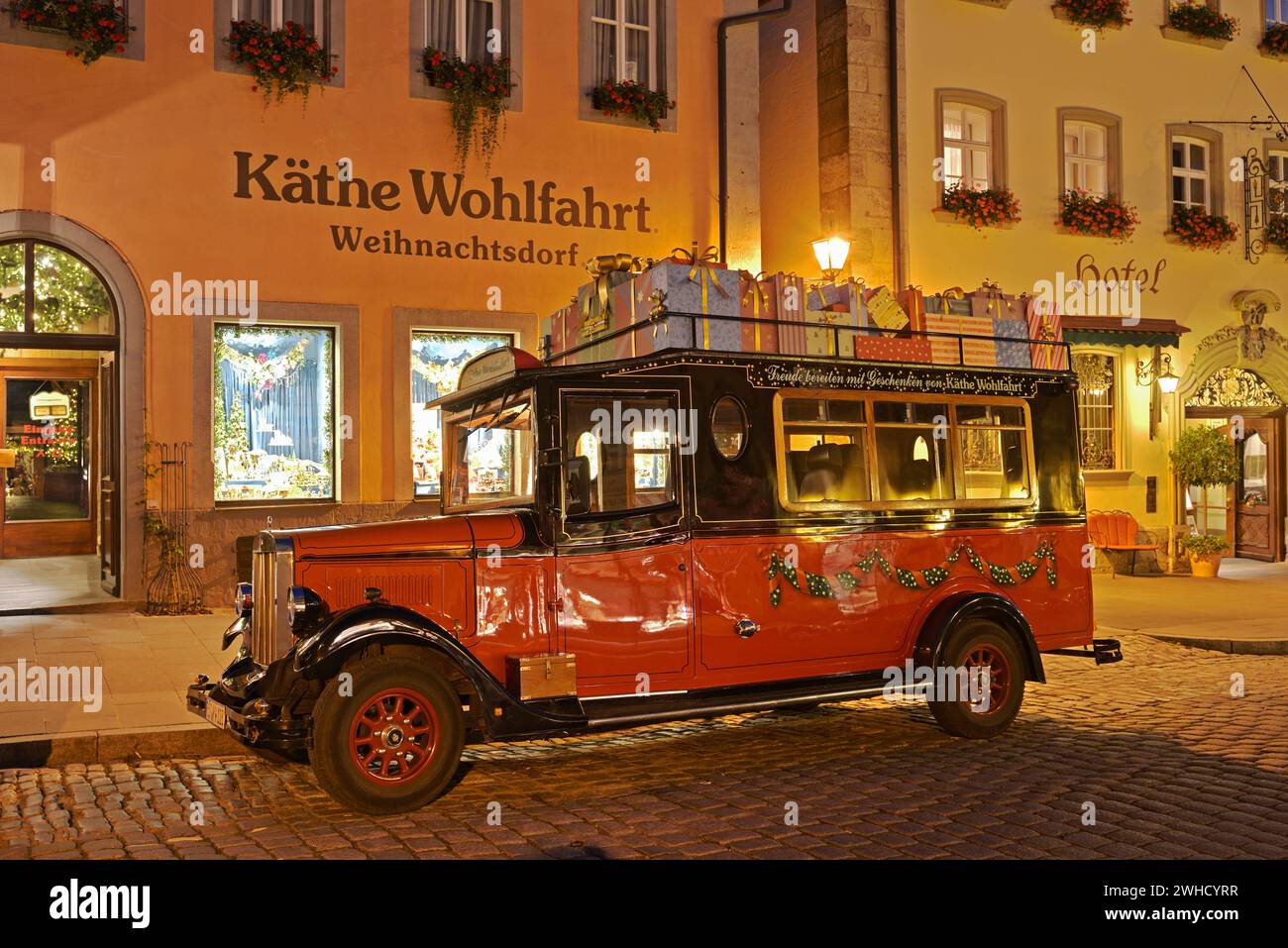 Käthe Wohlfahrt Christmas Village store, in front of it a vintage car, Rothenburg ob der Tauber, Middle Franconia, Bavaria, Germany Stock Photo