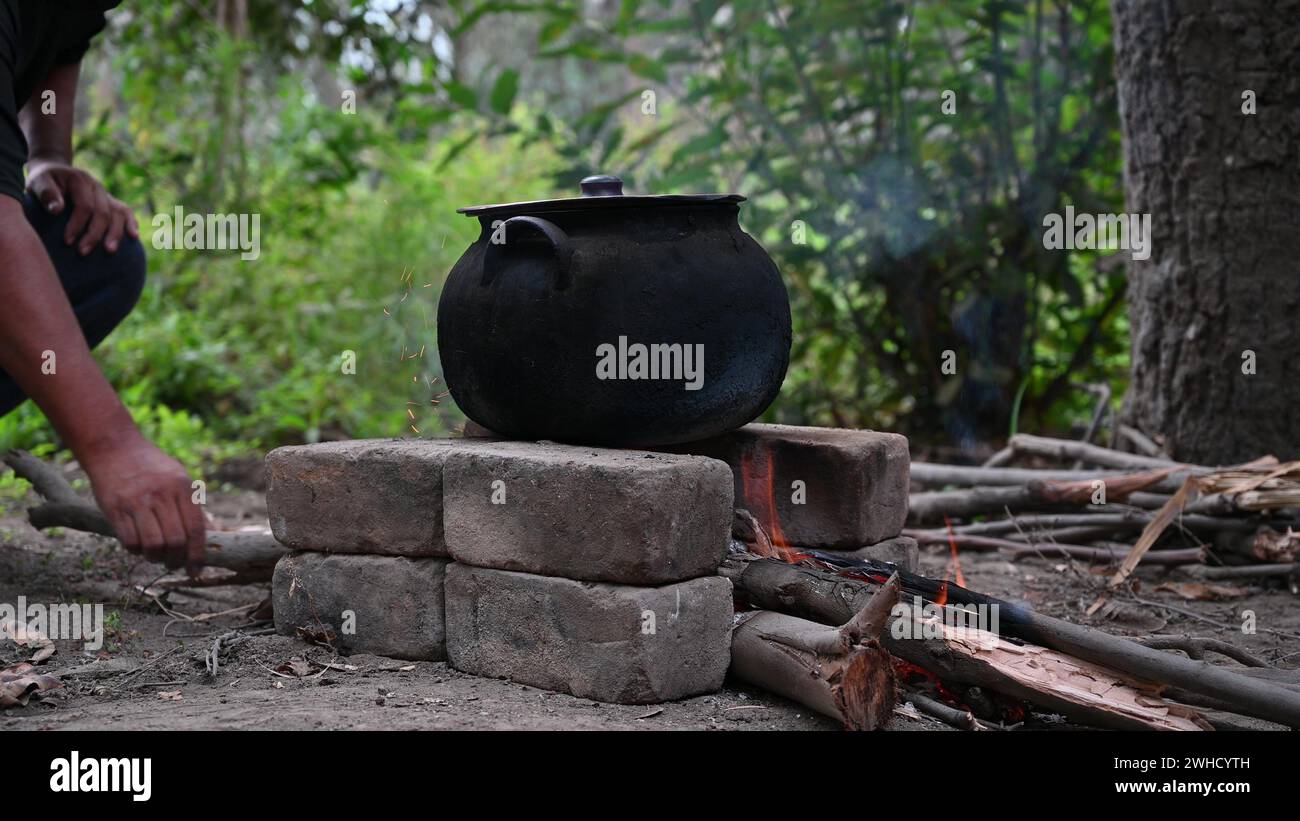 Outdoor cooking in a steel pot, camp kitchen with wood Stock Photo - Alamy