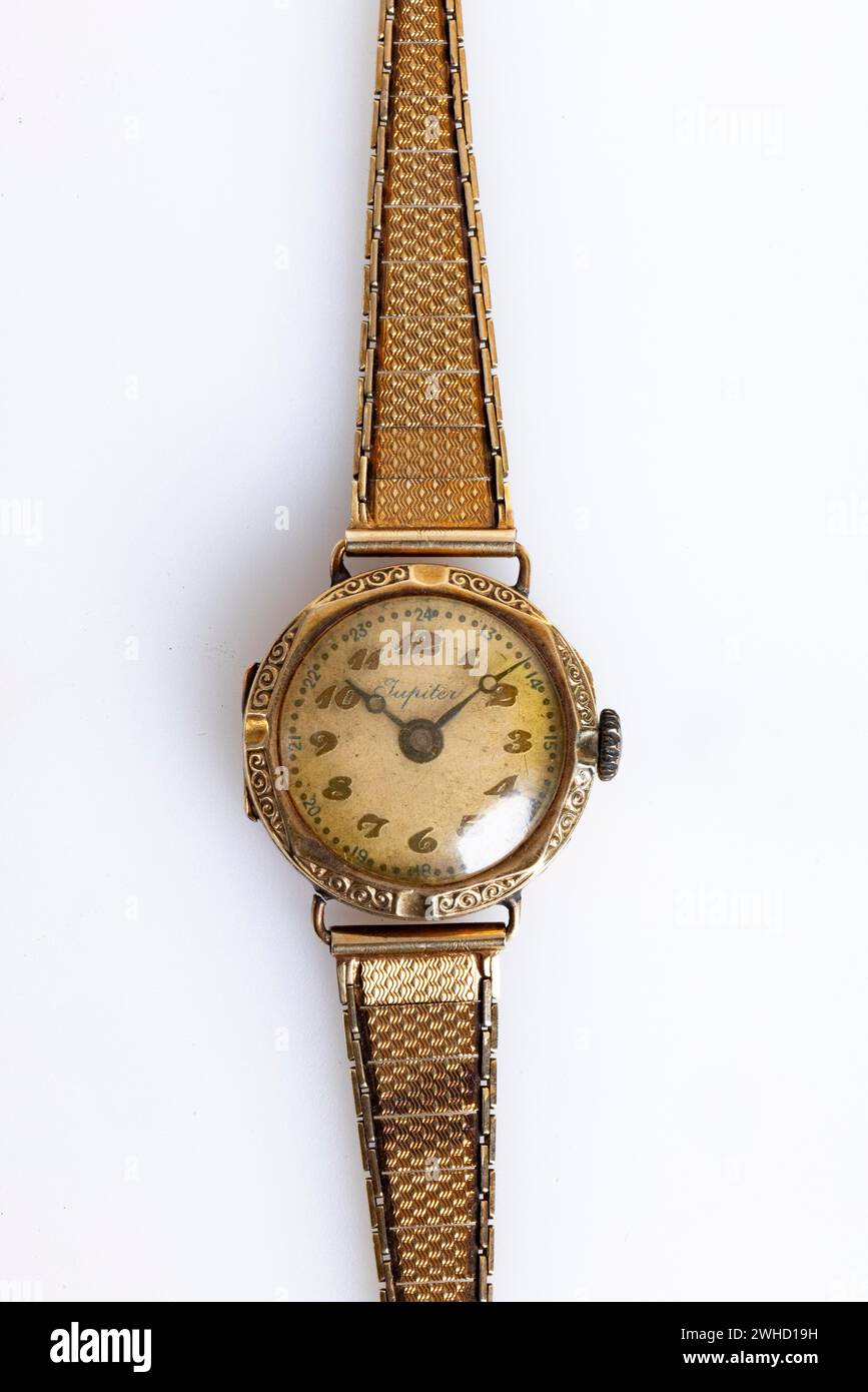Antique gold wristwatch on a white background Stock Photo