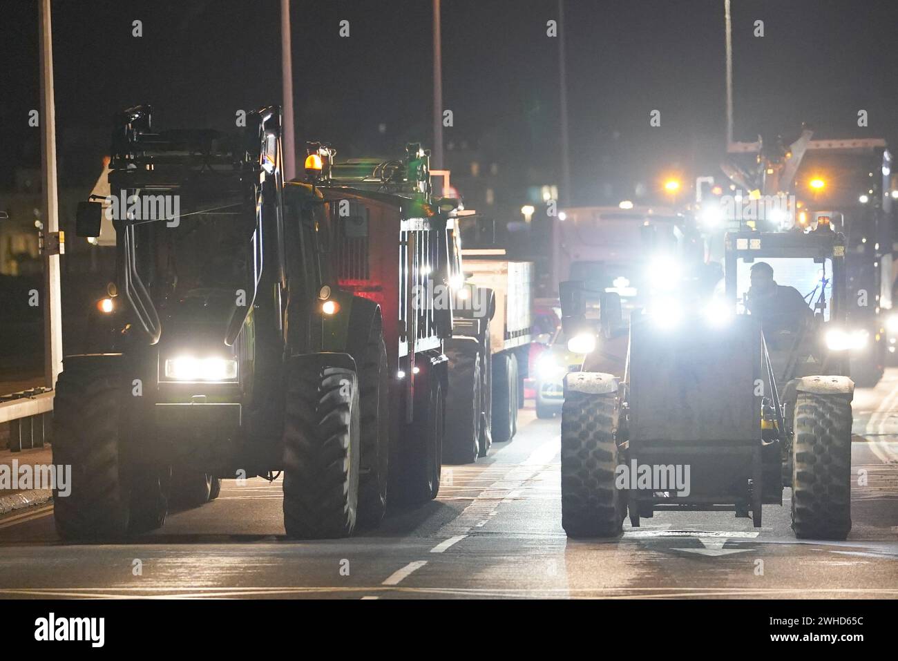 Farmers using their vehicles to cause disruption and slow traffic around the Port of Dover as they protest against cheap meat imports. Picture date: Friday February 9, 2024. Stock Photo