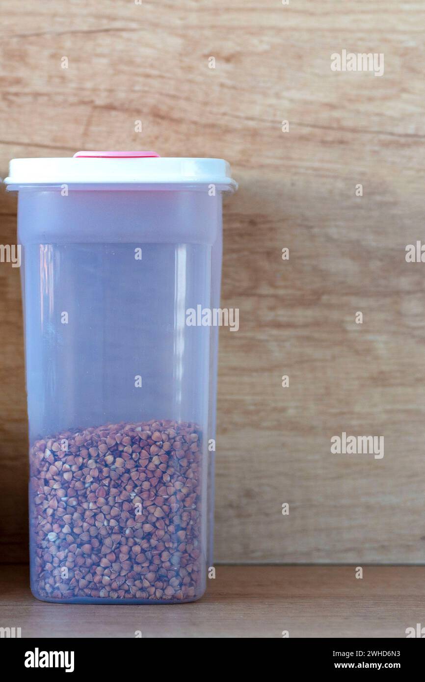 boxes of cereal of different types. Millet groats. plastic containers