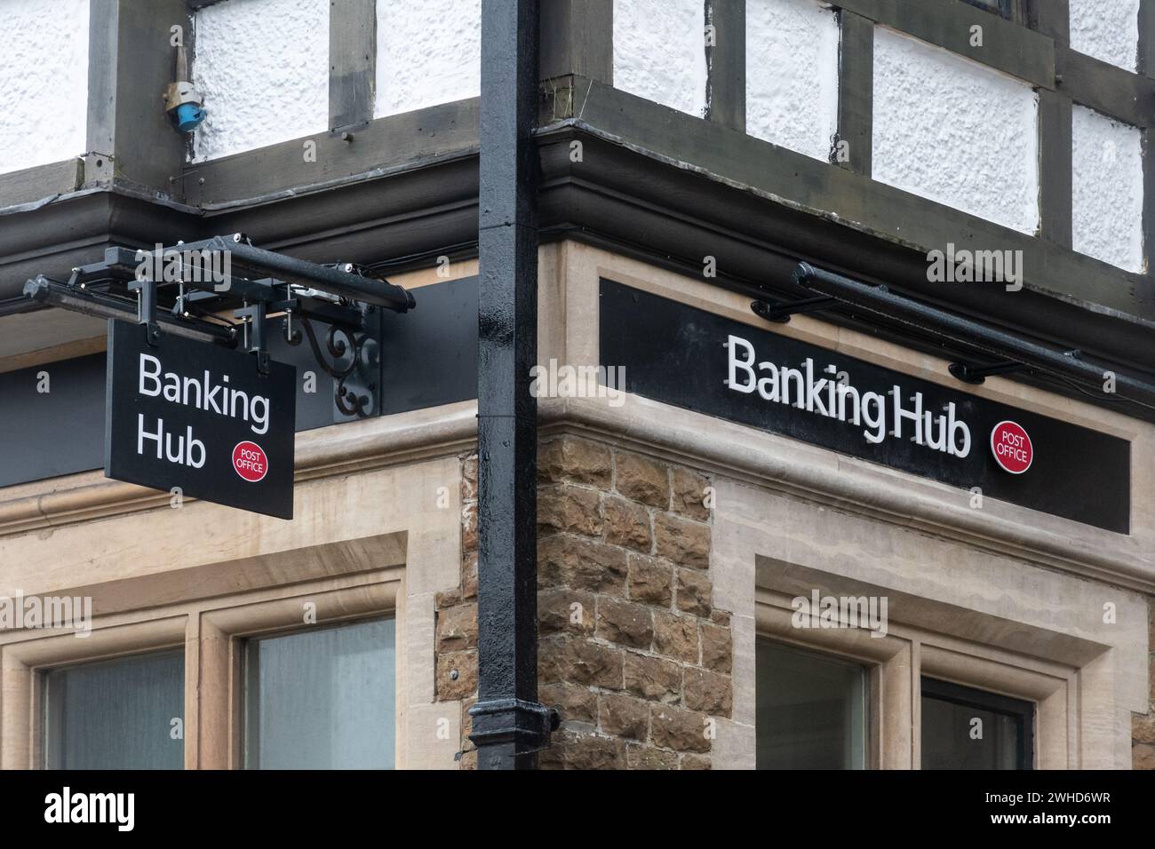 Banking hub run by post office in Haslemere town, Surrey, England, UK. Hubs are shared spaces on the high street serving customers of multiple banks. Stock Photo