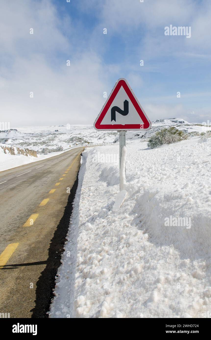 Dangerous curves sign Stock Photo - Alamy