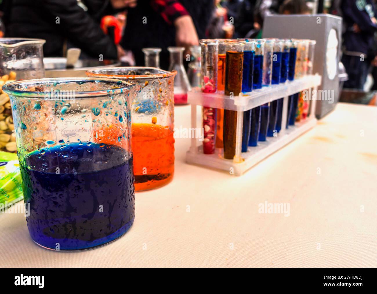 Flasks with liquid of colors. Laboratory glassware with solutions of different colors on table.Concept results of researches and scientific experience Stock Photo