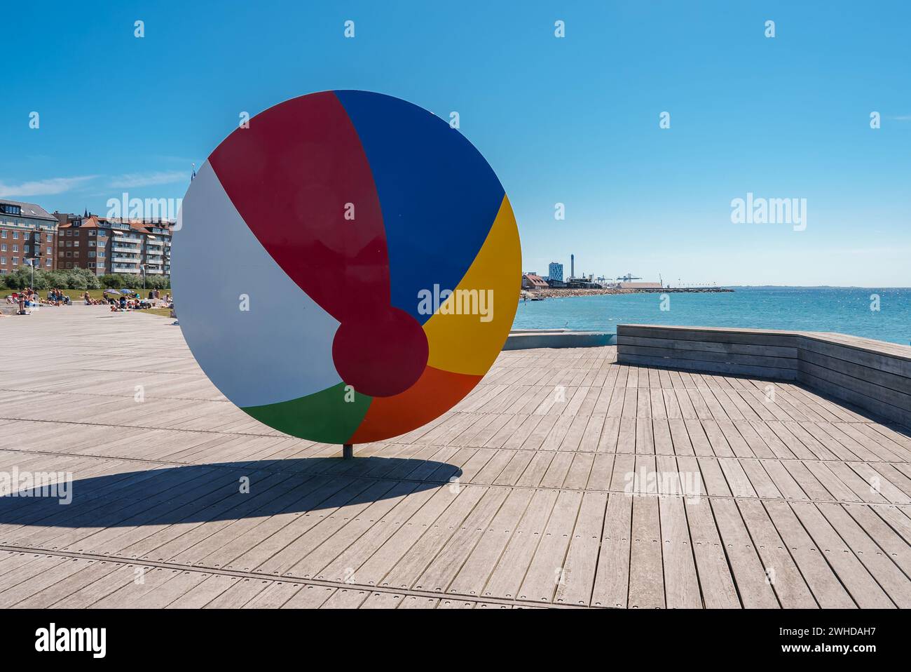 Vibrant Circular Sculpture Displayed on a Boardwalk in a Nordic City Stock Photo