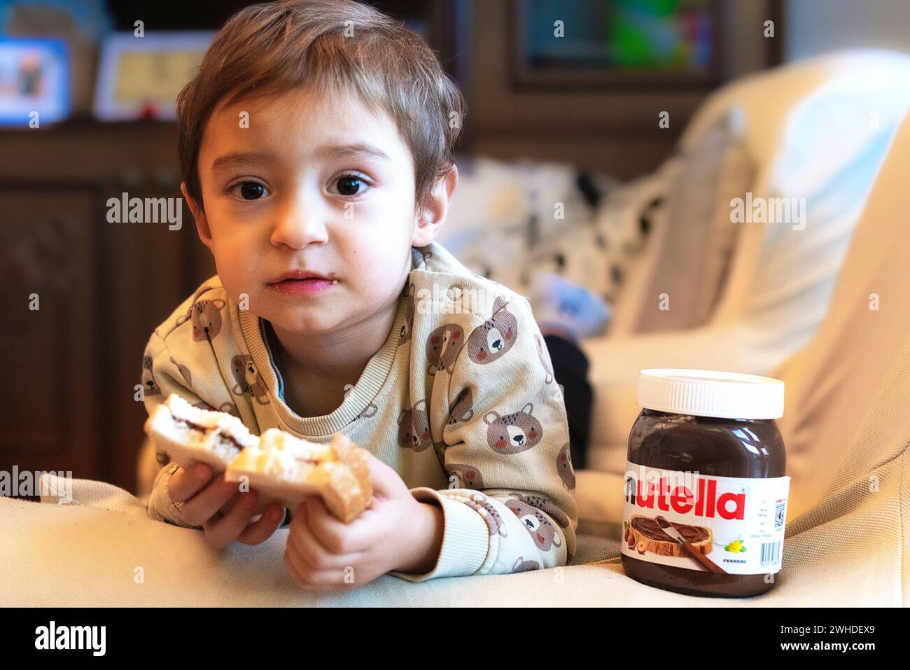 A relaxing afternoon snacking on Nutella. Stock Photo
