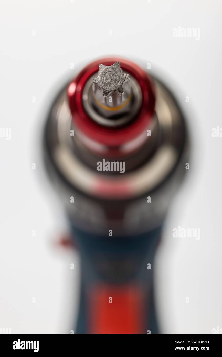 Cordless drill driver with bit holder and inserted Torx bit, detail