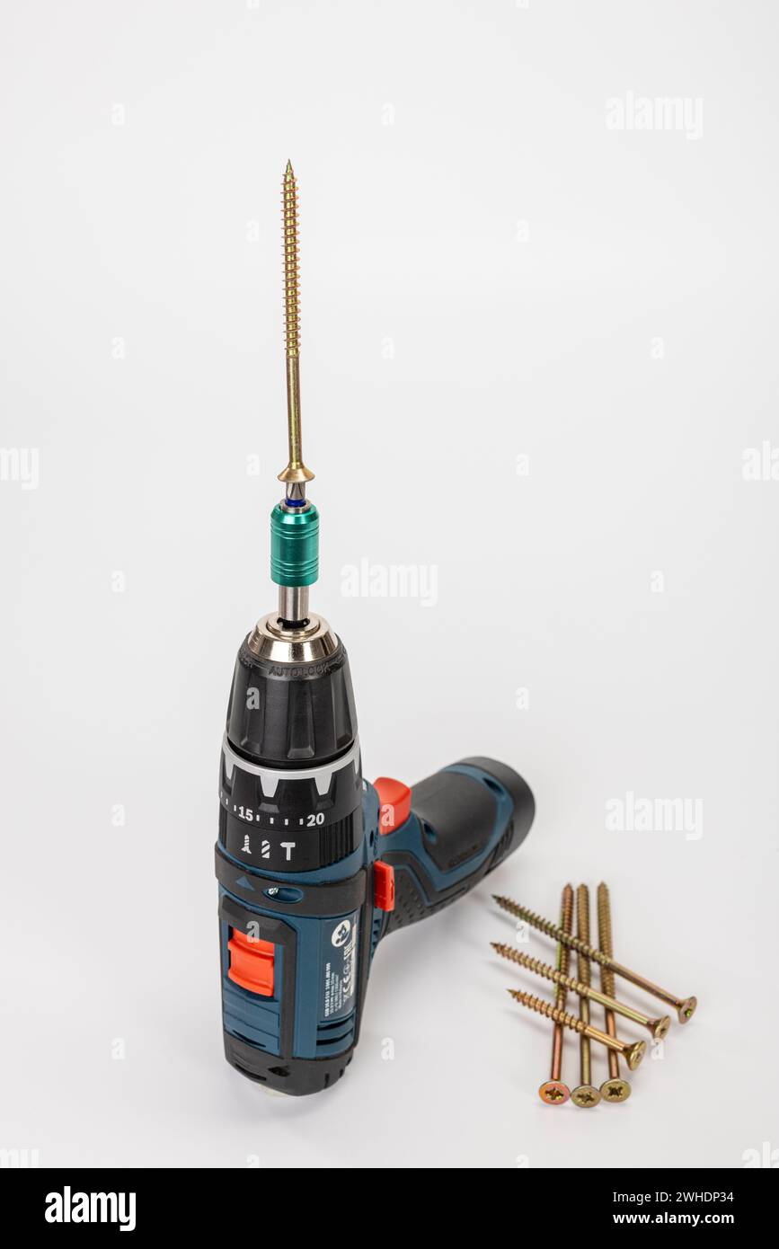 Cordless drill driver with bit holder and inserted Torx bit, Torx wood