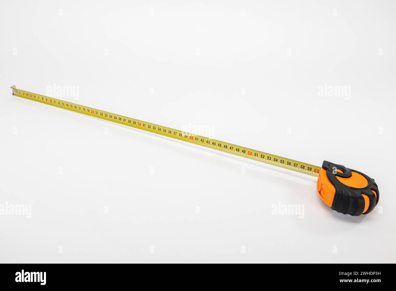 Yellow measuring tape with millimeter and centimeter graduations, measuring tool, white background, Stock Photo
