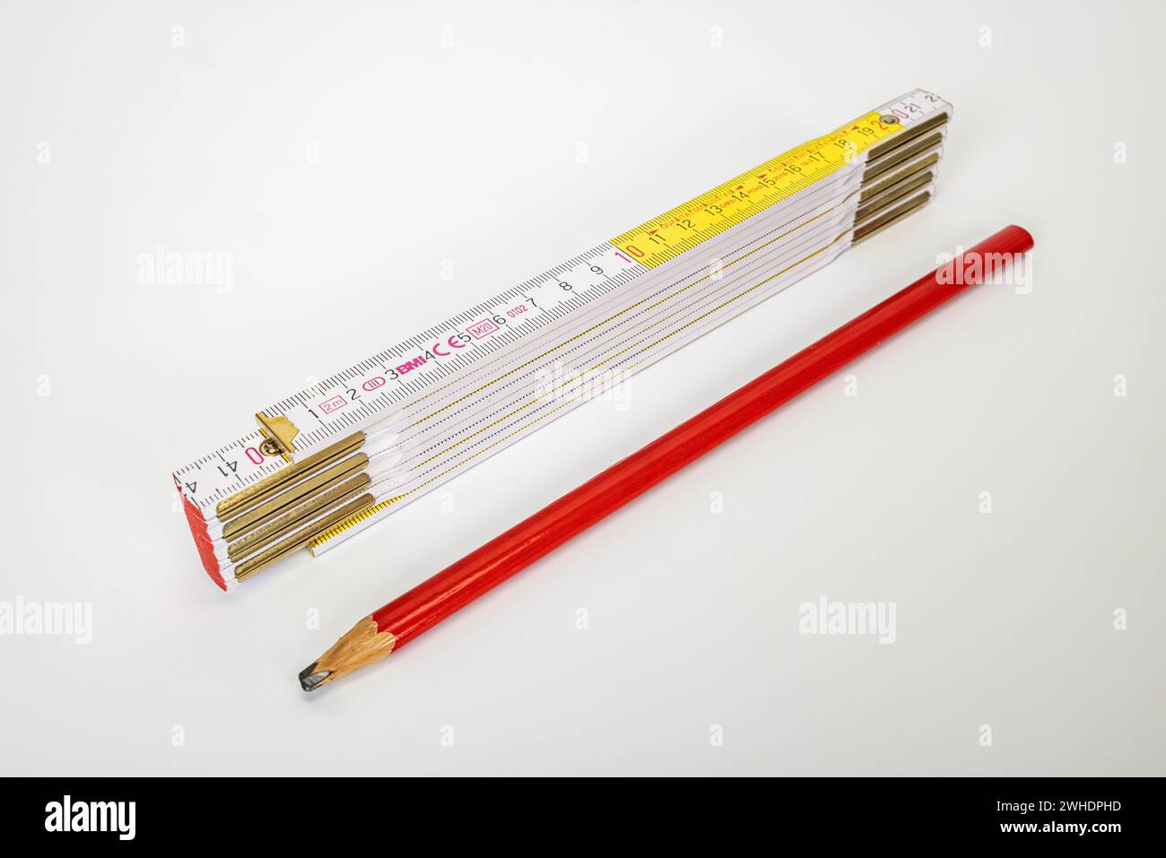 Carpenter's pencil, folding rule, folding ruler, white background, Stock Photo