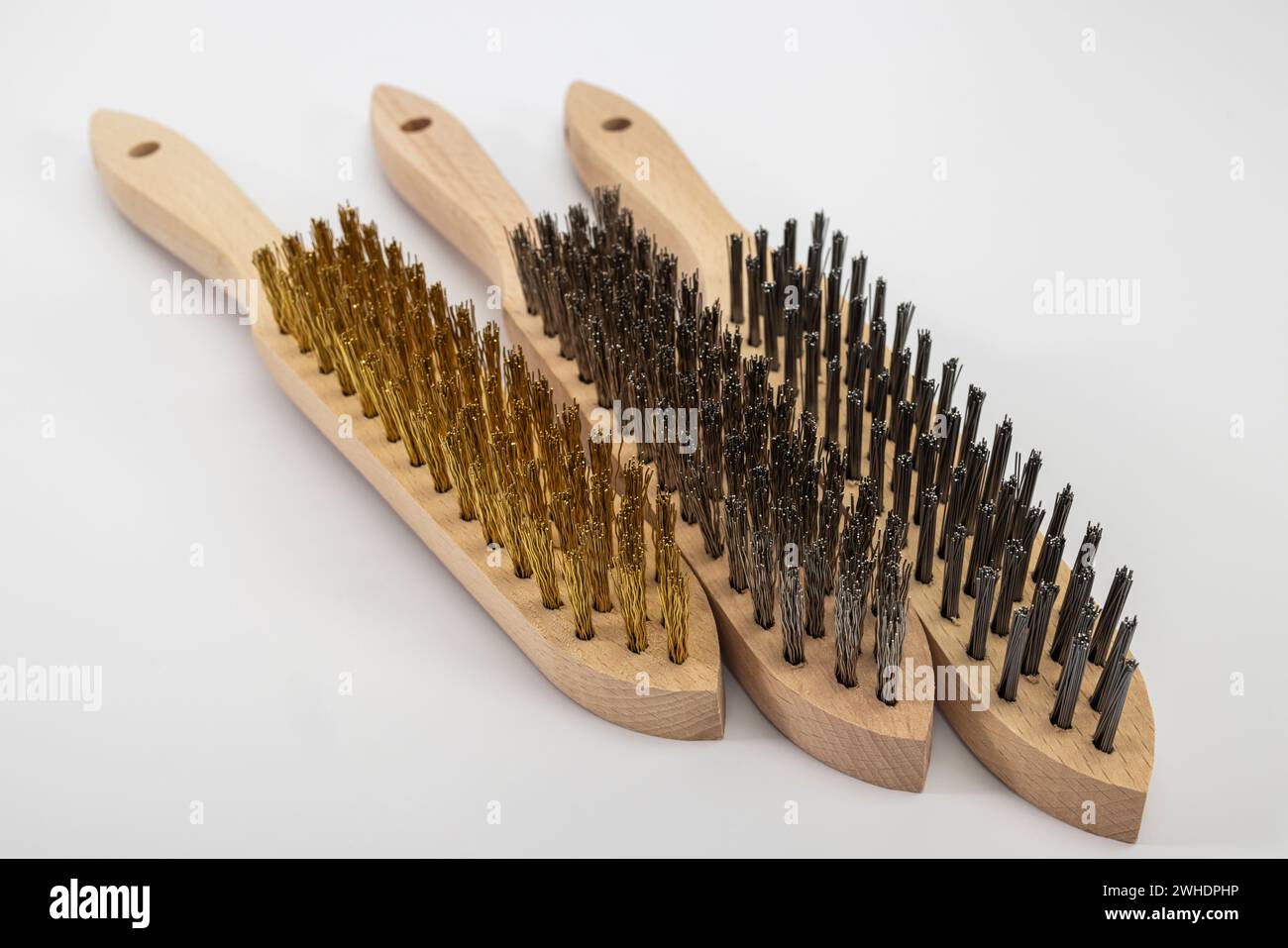 Three hand wire brushes with wooden handle, brass brush, stainless