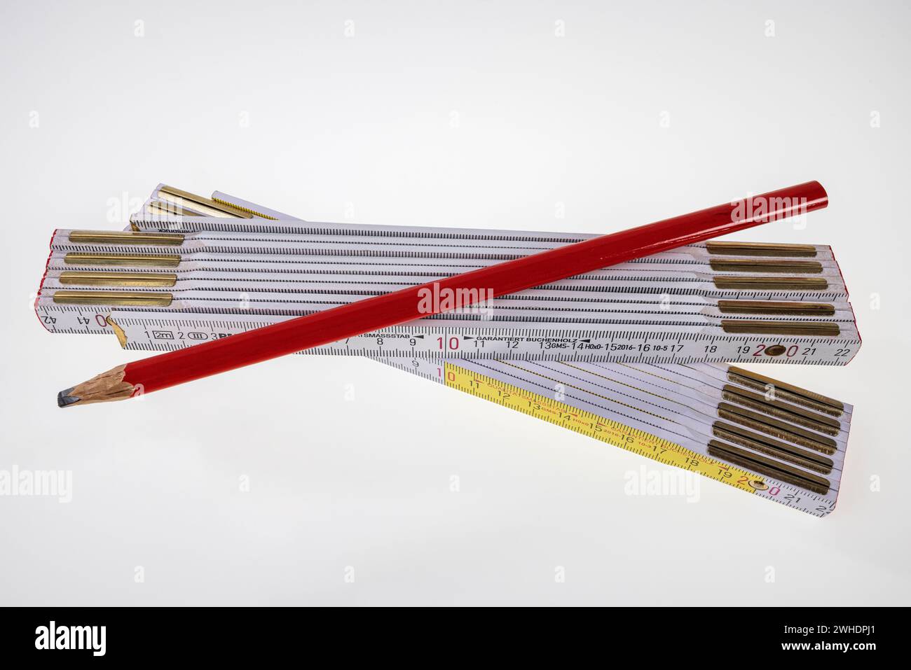 Carpenter's pencil, two folding rules, folding ruler, white background, Stock Photo