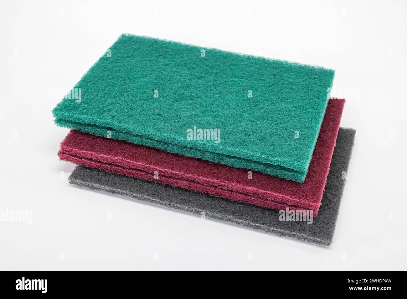 Abrasive fleece, various grain sizes, structure, colors, white background, Stock Photo