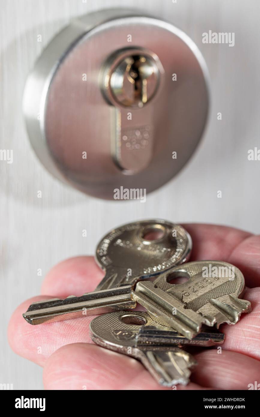 Man's hand holding a broken cylinder key, cylinder lock, detail, symbolic image, broken apartment key, Stock Photo