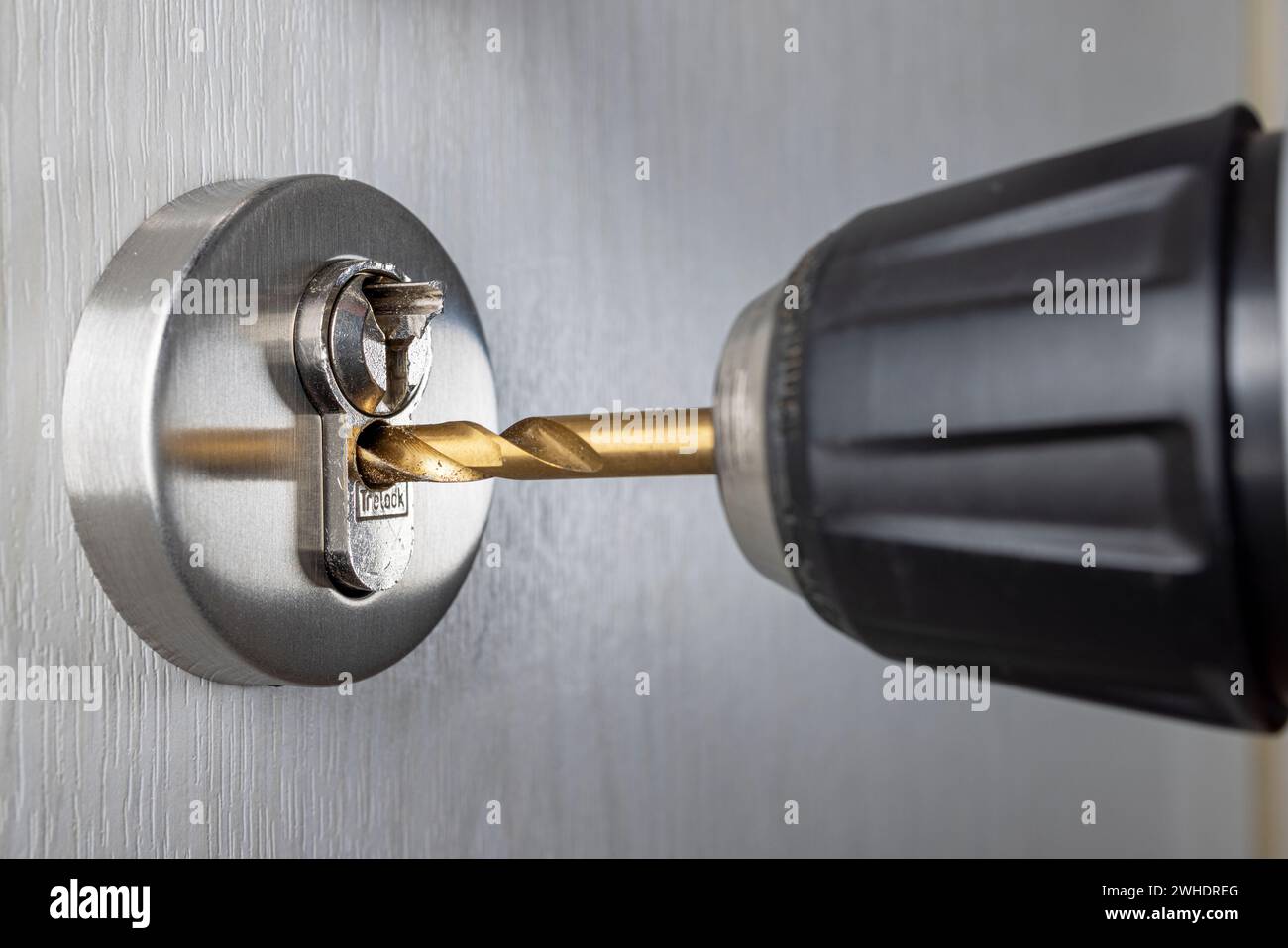 Broken door key, drilling out cylinder lock with drill, detail