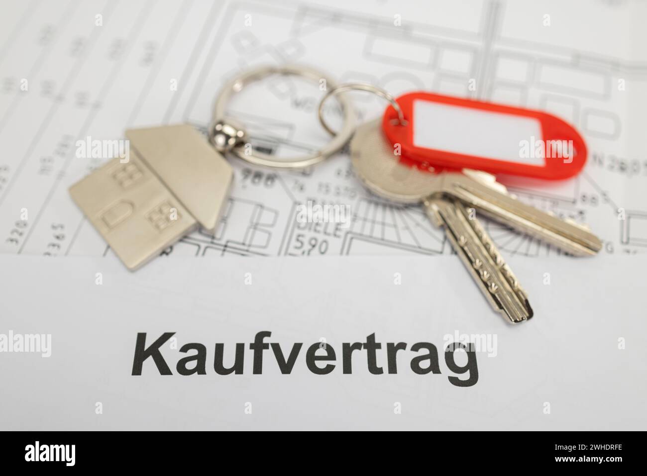 Key ring with metal key fob house, red key fob, without labeling, sales contract, floor plan, Stock Photo