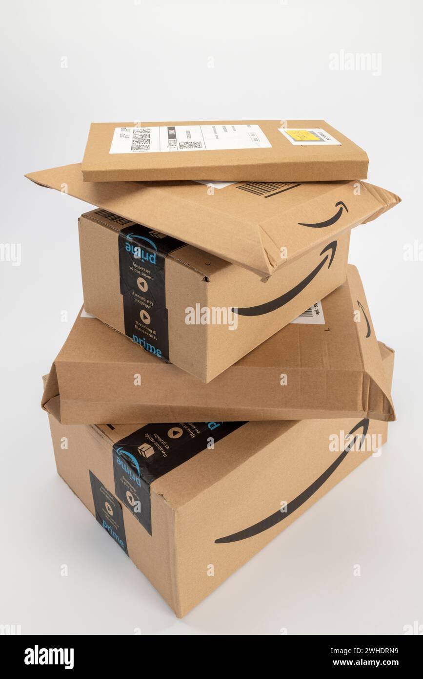 Several Amazon Prime packages stacked, different sizes, white background, symbol image, Prime
