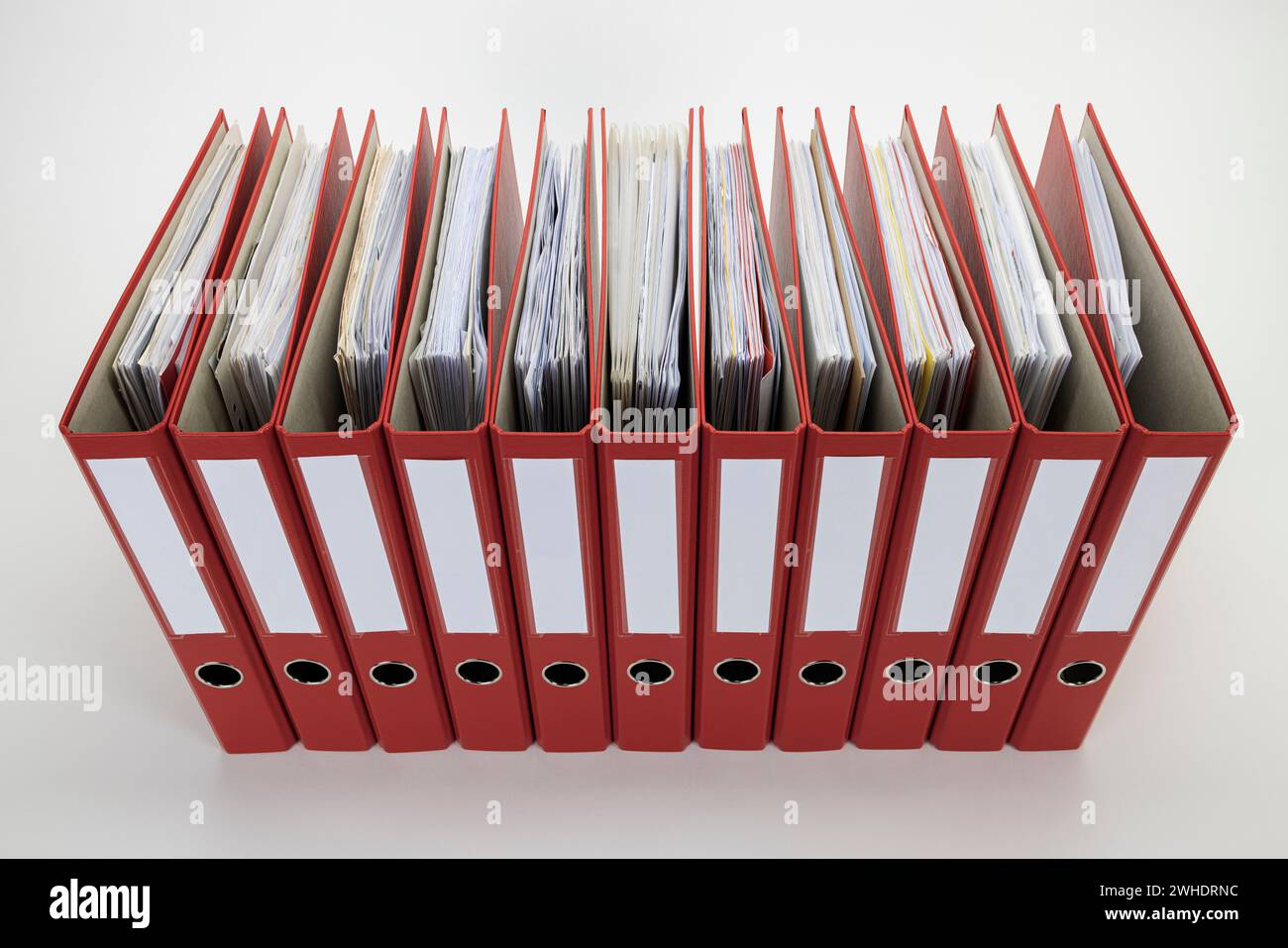 Red file folders without labeling, white background, Stock Photo