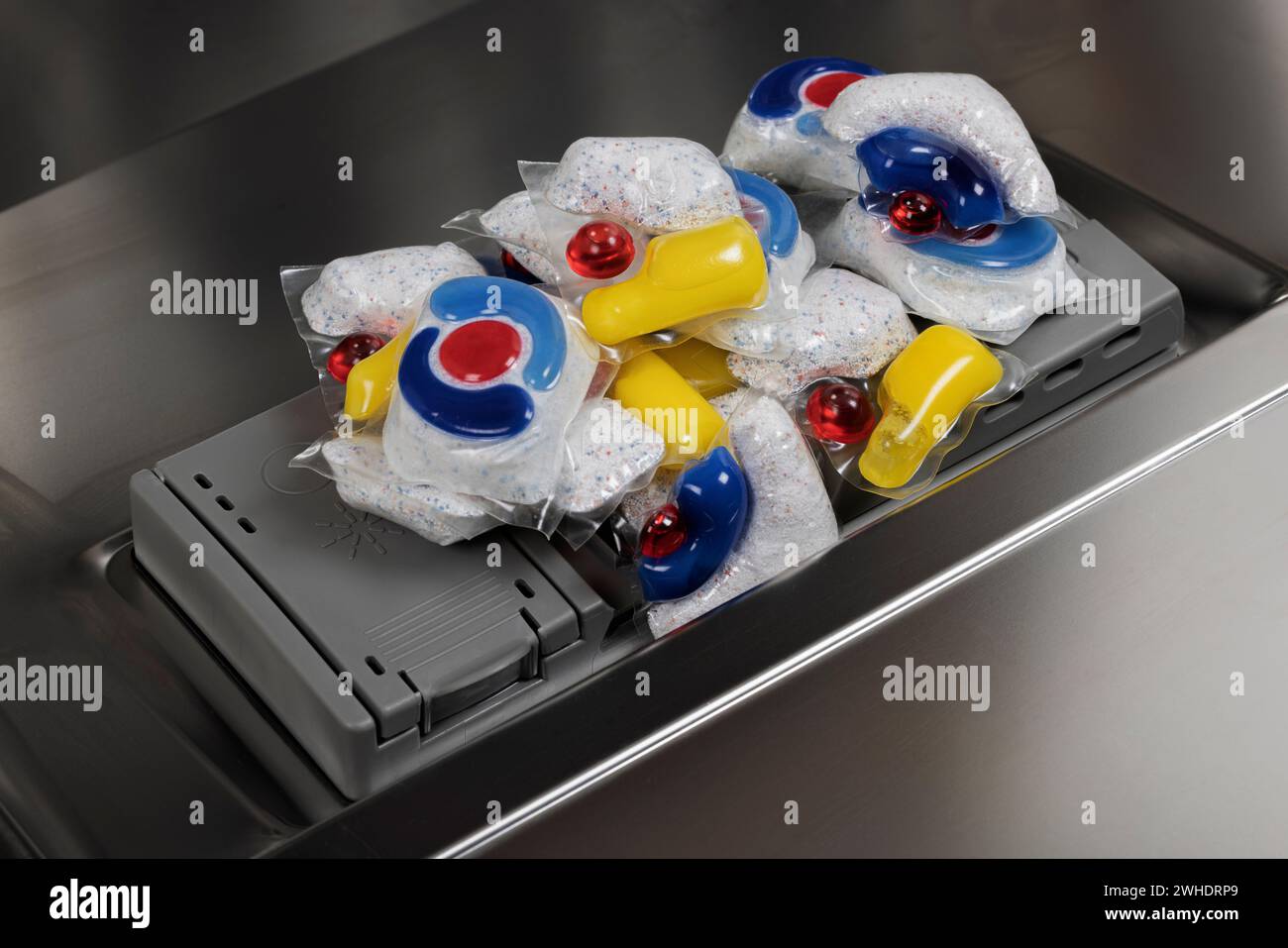 Dosing chamber, many dishwasher detergent tabs in water-soluble foil, various brands, dishwasher, detail, Stock Photo