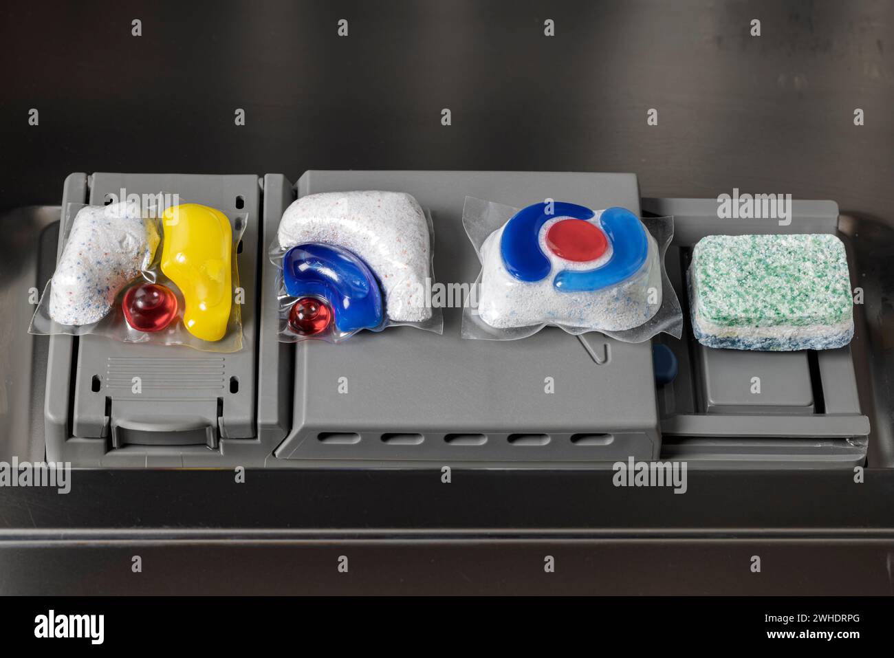 Dosing chamber, four dishwasher detergent tabs, various brands, dishwasher, detail, Stock Photo