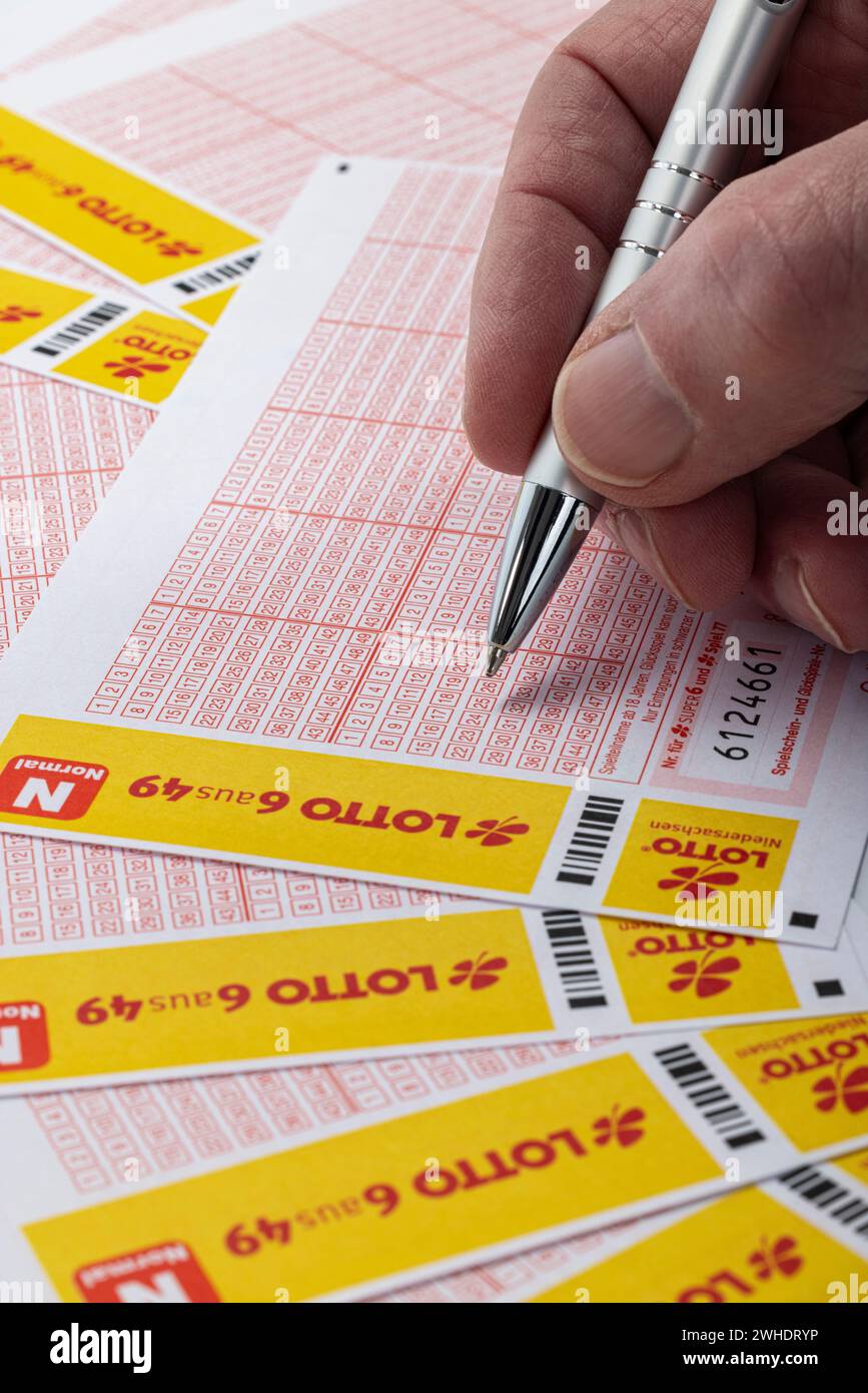 Man fills out lottery ticket, LOTTO 6aus49, ballpoint pen, detail, Stock Photo