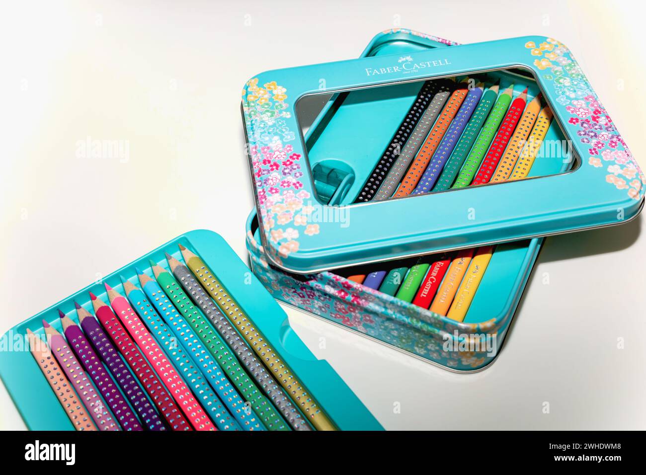 Faber-Castell colored pencils for drawing various colors and coloring book for children. Stock Photo