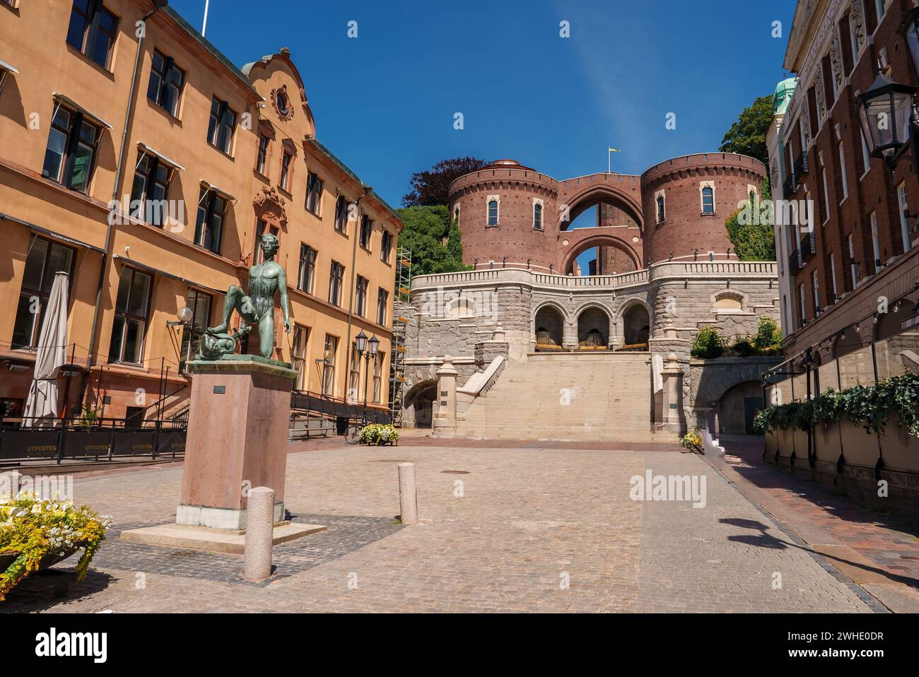 Sunny European Square with Bronze Statue and Historic Buildings, Helsingborg Stock Photo