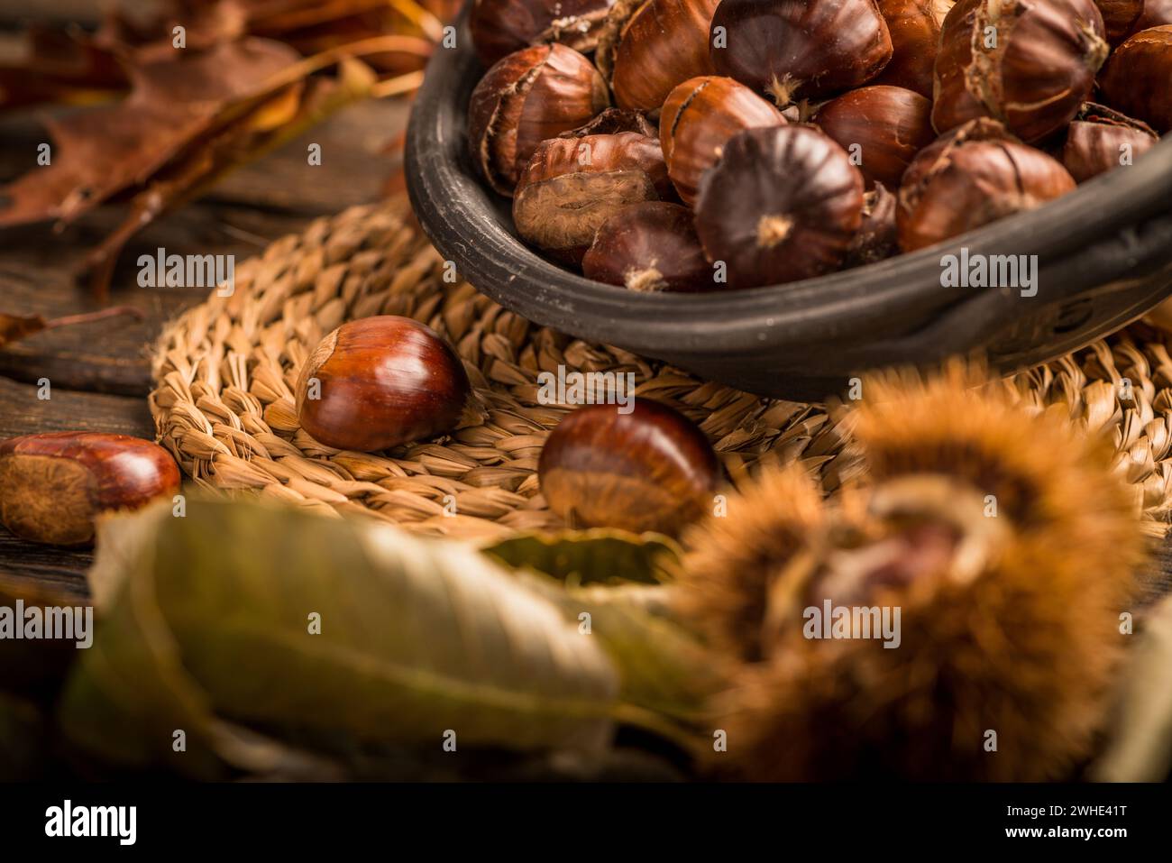 Roasted chestnuts and leaves Stock Photo - Alamy