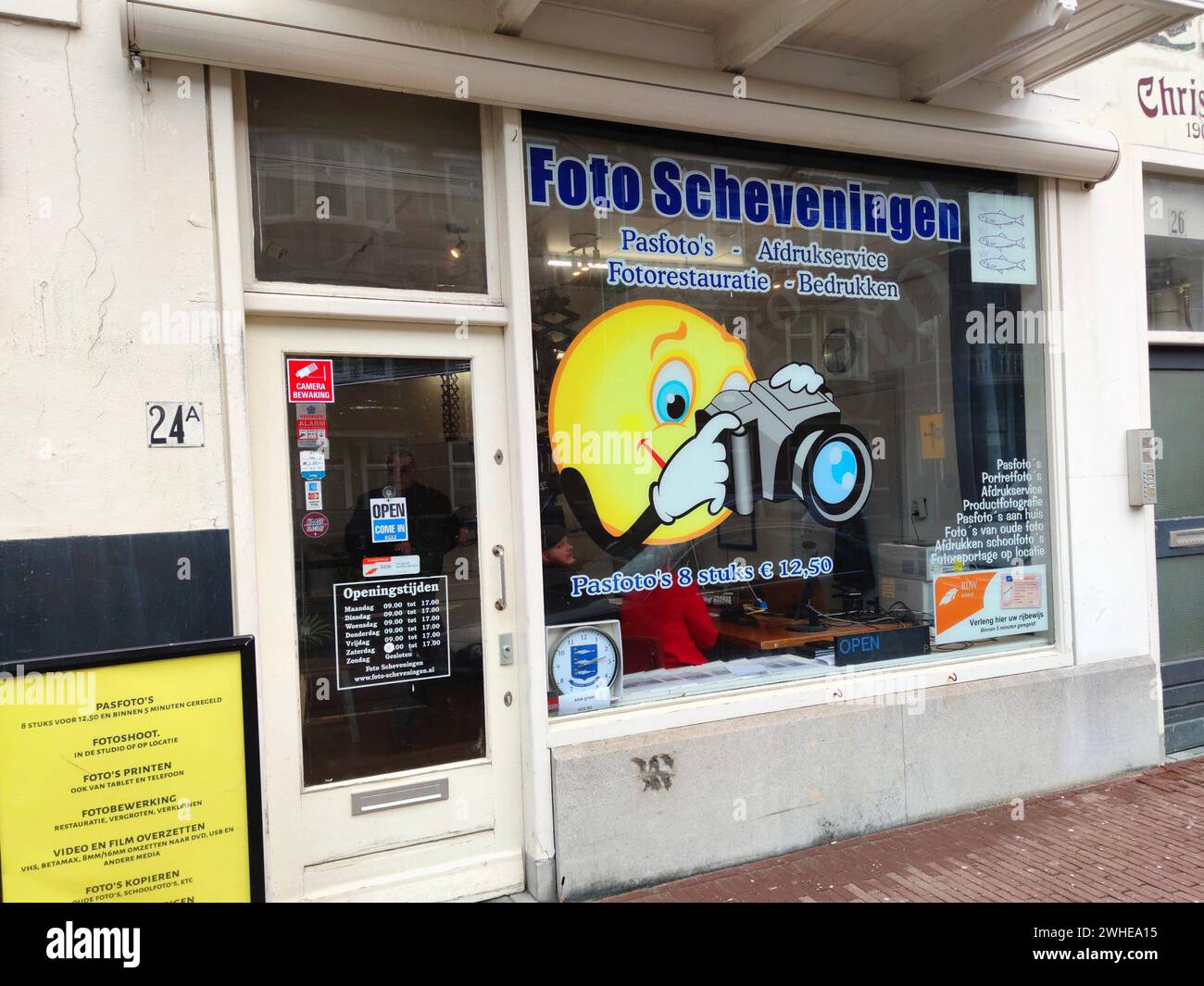 Photo shop with a photographing smiley on the window in the village of Scheveningen, the Netherlands Stock Photo