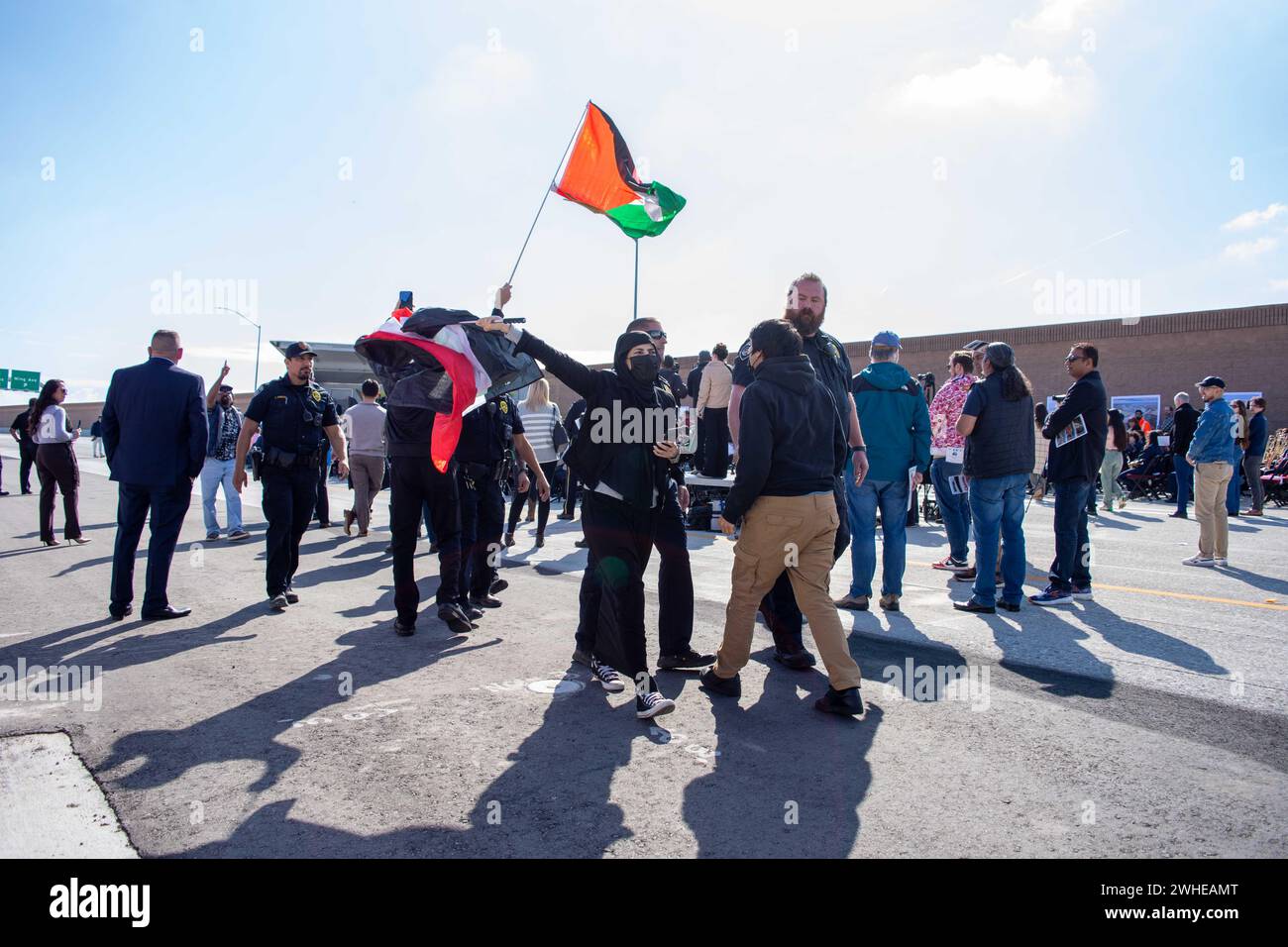 Bakersfield, USA. 09th Feb, 2024. Activists from the group the United Liberation Front disrupt dignitary speeches during the ribbon cutting ceremony for the completion of the Centennial Corridor in Bakersfield, California, on February 9, 2024. The long-standing project connects the Westside Parkway to Highway 58 East. The planning and construction have been in the making for multiple decades. (Photo by Jacob Lee Green/Sipa USA) Credit: Sipa USA/Alamy Live News Stock Photo