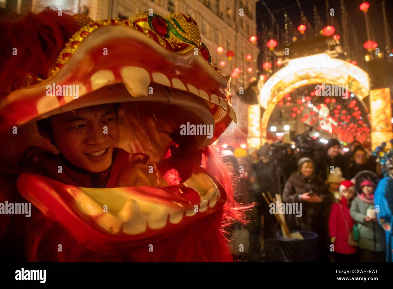 Moscow, Russia. 9th of February, 2024. Chinese man wearing a lion costume performs during a ceremony in Kamergersky Lane to open the Moscow Festival of Chinese New Year in central Moscow, Russia. Credit: Nikolay Vinokurov/Alamy Live News Stock Photo