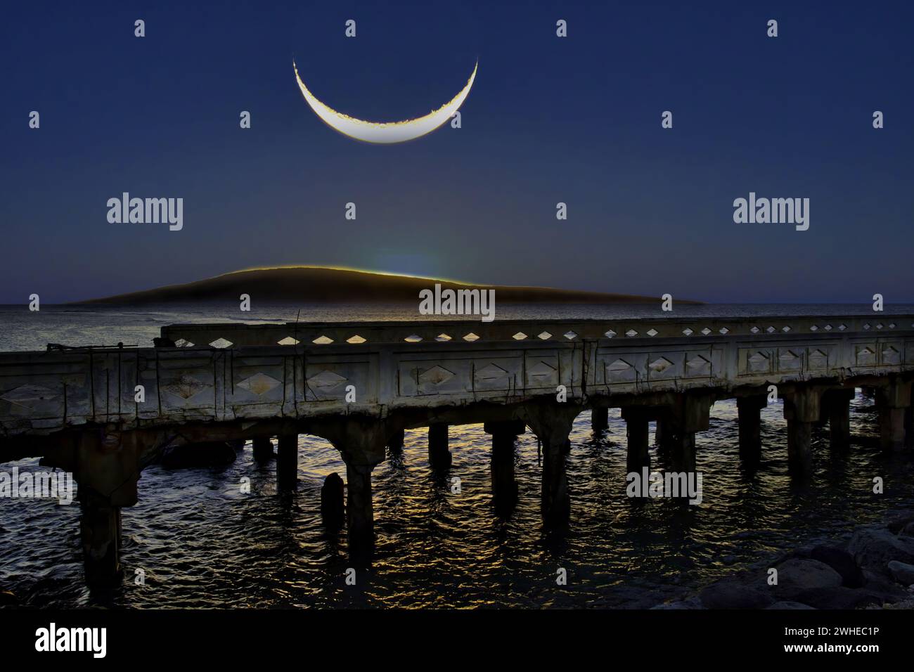Large setting crescent moon  over Lanai Stock Photo