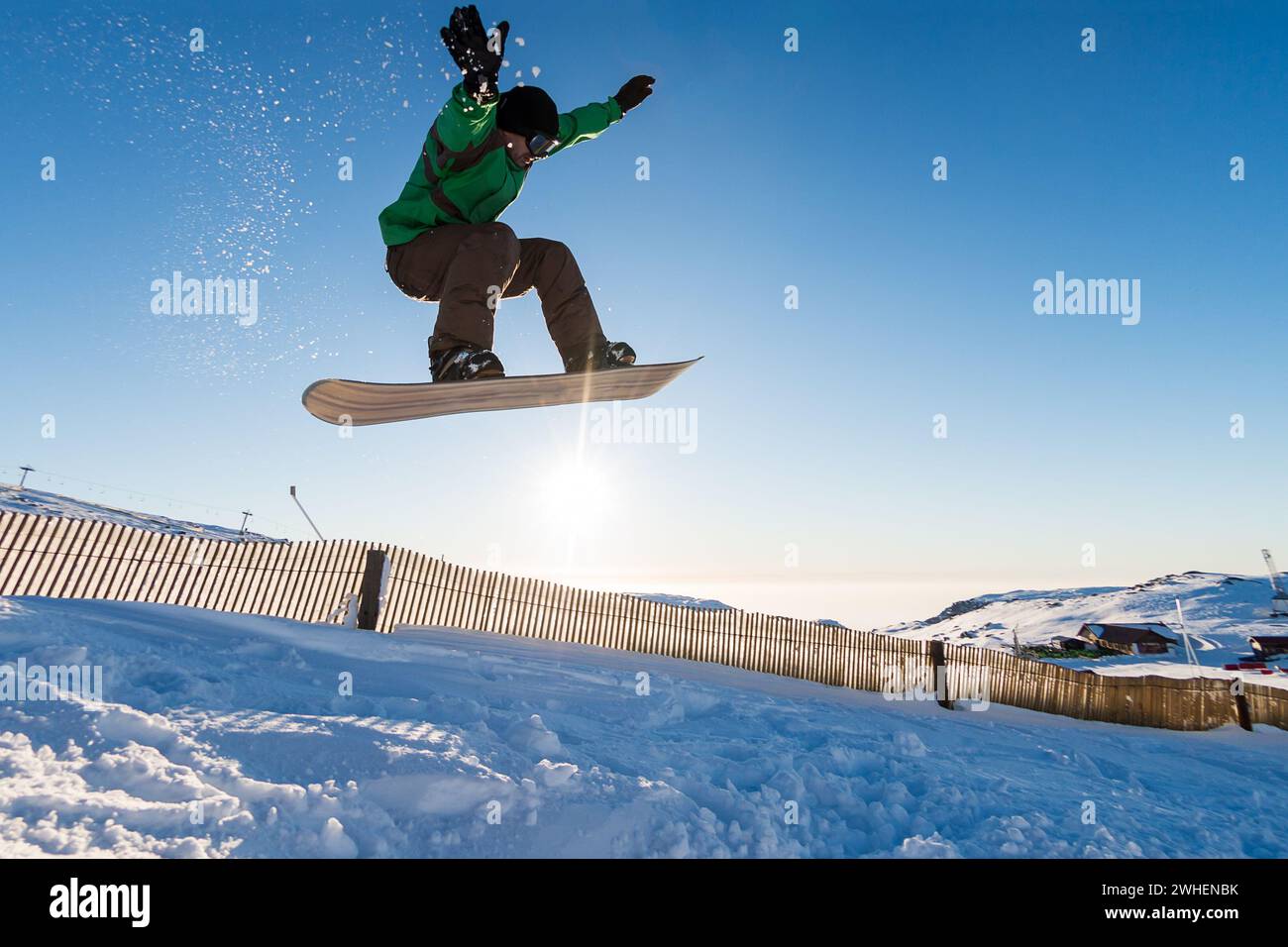 Snowboarder at jump Stock Photo