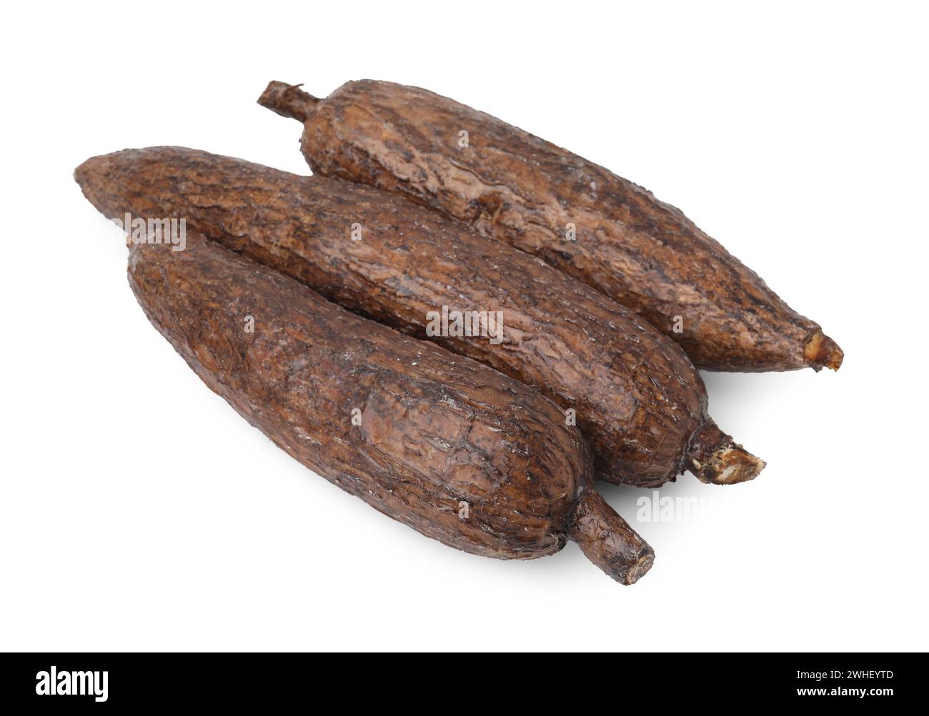 Three whole ripe cassava roots isolated on white Stock Photo Alamy