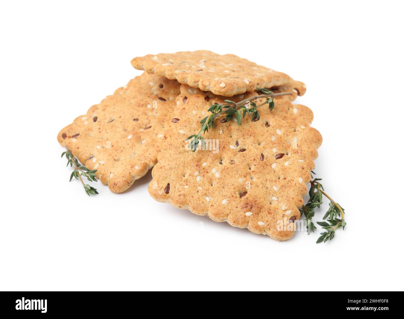 Cereal crackers with flax, sesame seeds and thyme isolated on white ...