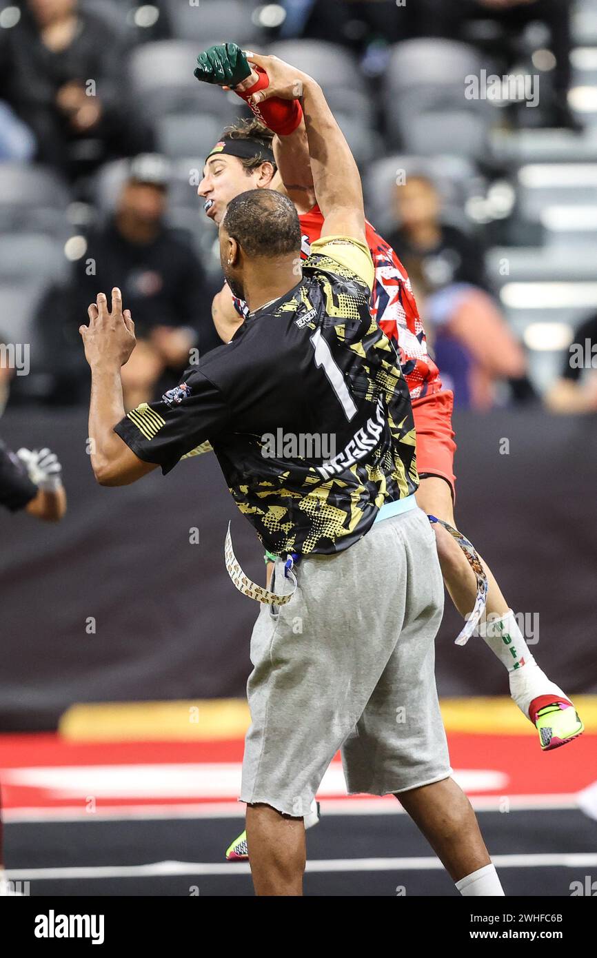 Henderson, NV, USA. 08th Feb, 2024. Sports Agent Sean Stellato rushes retired NBA player Tracy McGrady during the 24th annual Celebrity Flag Football Challenge at the Dollar Loan Center in Henderson, NV. Christopher Trim/CSM/Alamy Live News Stock Photo