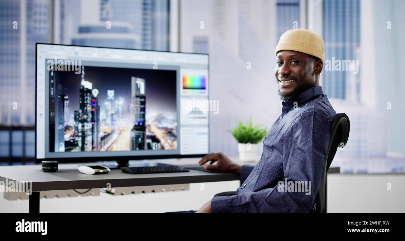 African Graphic Web Designer Using Design Editing Software Stock Photo