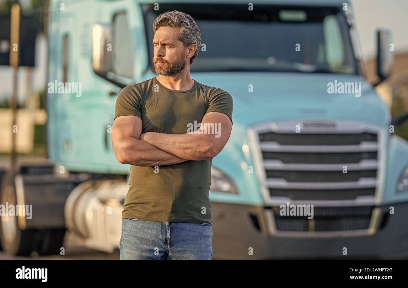 Semi trucks vehicle. Trucking owner. hispanic man posing in front of truck. Semi trucks vehicle. man driver near truck. Man owner truck driver near tr Stock Photo