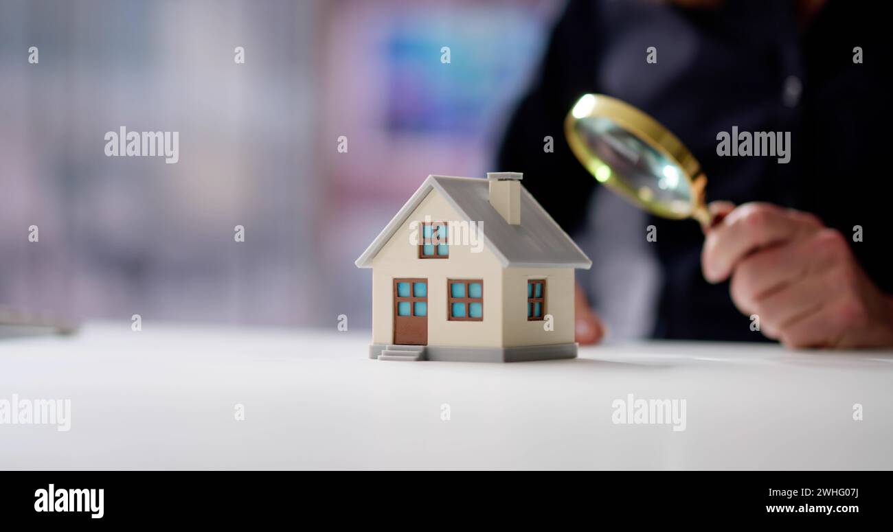 Real Estate House Appraisal By Inspector With Magnifier Stock Photo
