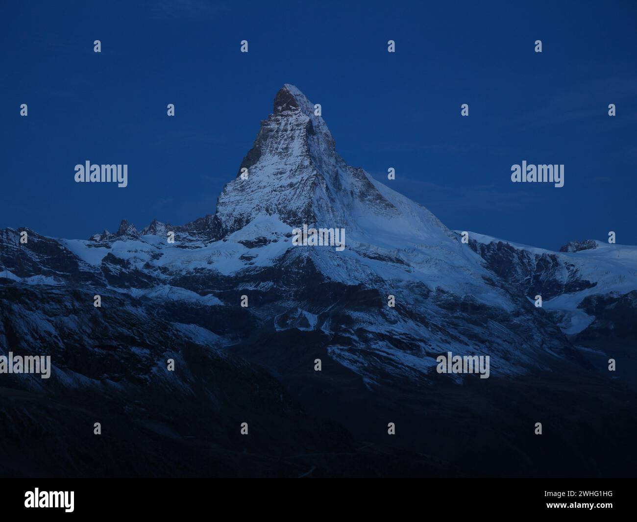 Matterhorn in the blue hour seen from Fluhalp. Stock Photo