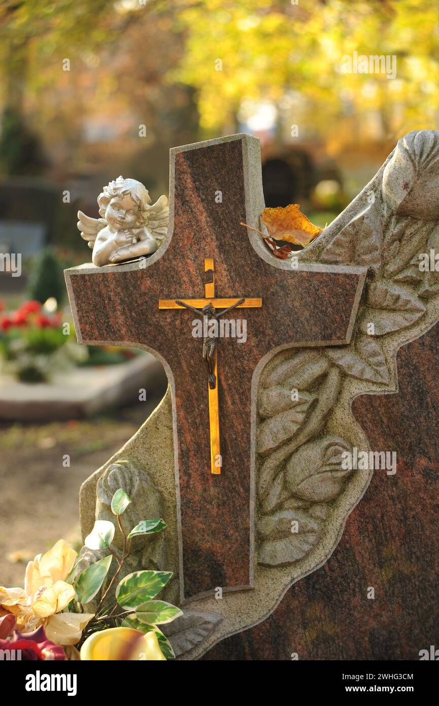 Gravestone with Cross and angels Stock Photo