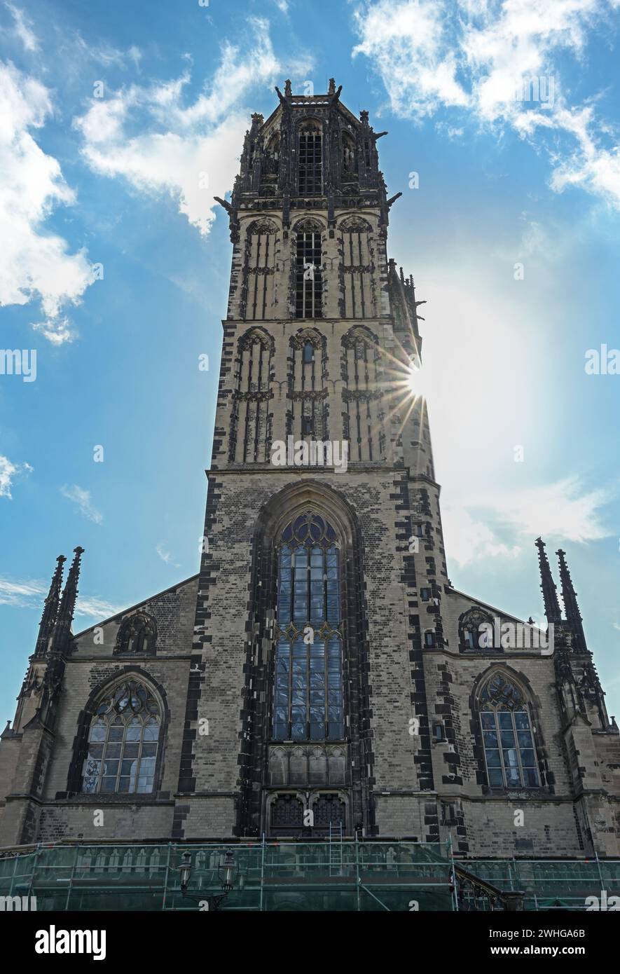 Tower of the St. Salvator Church Duisburg, the Gothic basilica is today a Protestant city church, blue sky with white clouds, Ge Stock Photo