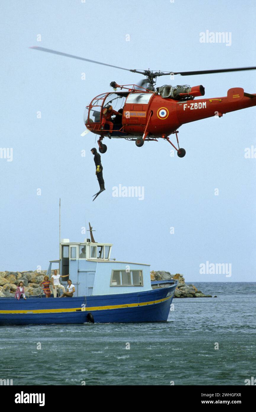 emergency helicopter jump to save people from boat france Stock Photo