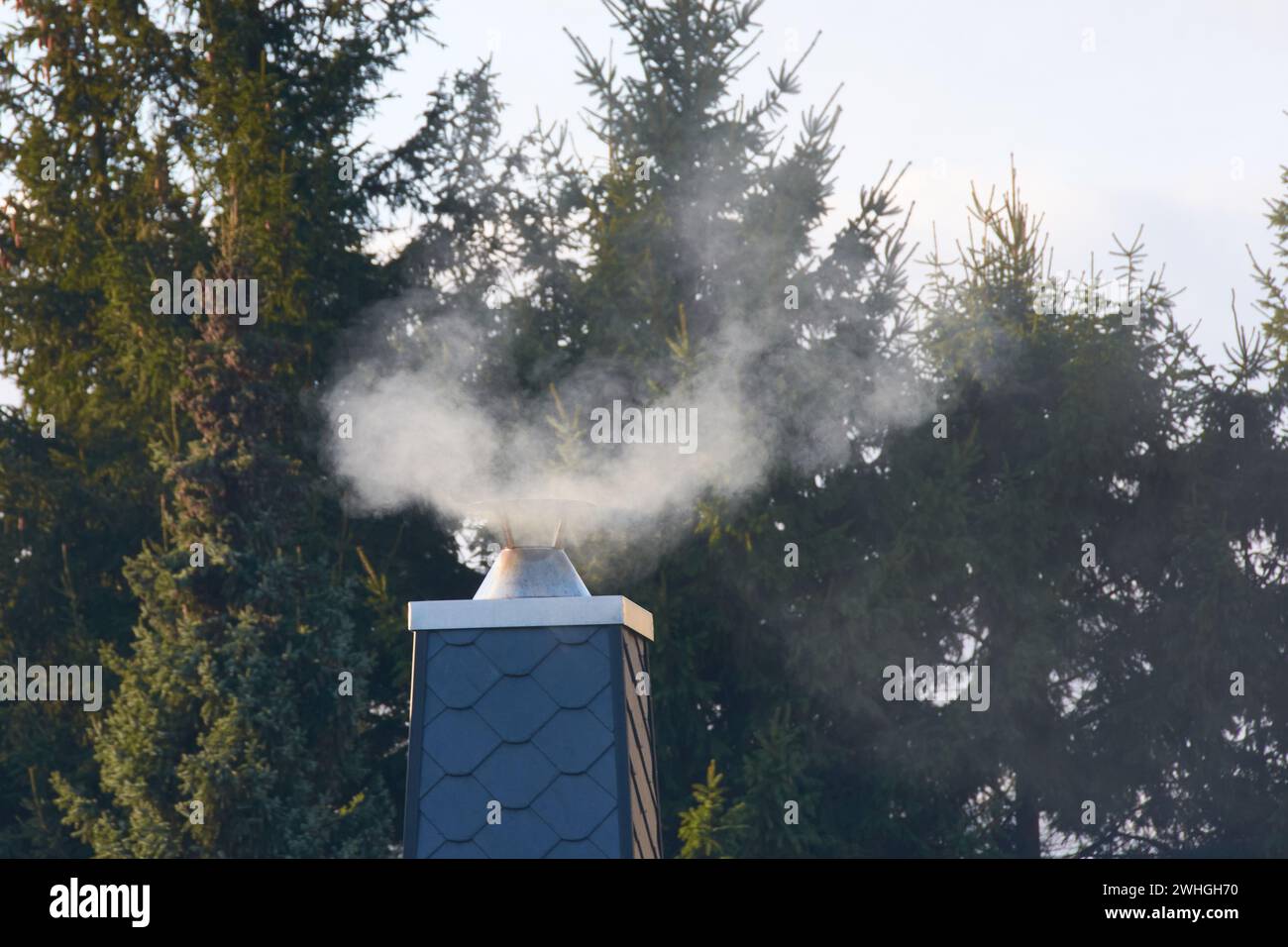 Smoking chimney flue Stock Photo