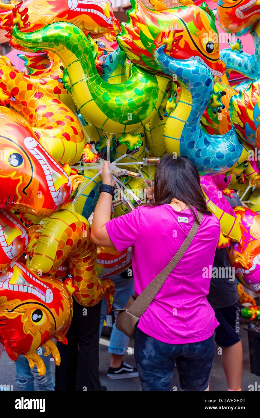 Sydney Australia 10 Feb 2024: Lunar New Year kicked off in earnest today with big crowds of people flocking to China Town in Sydney to eat and celebrate. Inflated toy dragons were not surprisingly very popular among young children with 2024 being the year of the Dragon. Food from many different nations was selling from restaurants and specially set up stalls to keep everyone fed and happy. Credit: Stephen Dwyer / Alamy Live News Stock Photo