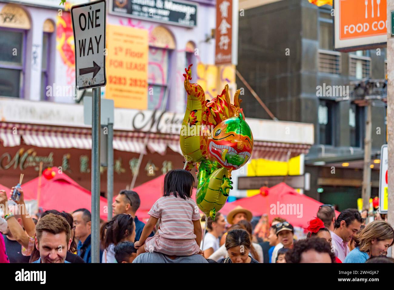 Sydney Australia 10 Feb 2024: Lunar New Year kicked off in earnest today with big crowds of people flocking to China Town in Sydney to eat and celebrate. Inflated toy dragons were not surprisingly very popular among young and old children with 2024 being the year of the Dragon. Food from many different nations was selling from restaurants and specially set up stalls to keep everyone fed and happy. Credit: Stephen Dwyer / Alamy Live News Stock Photo