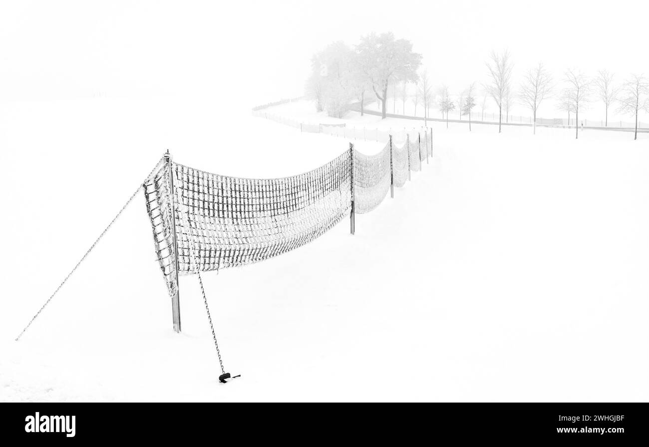 Snow fence in the fog Stock Photo