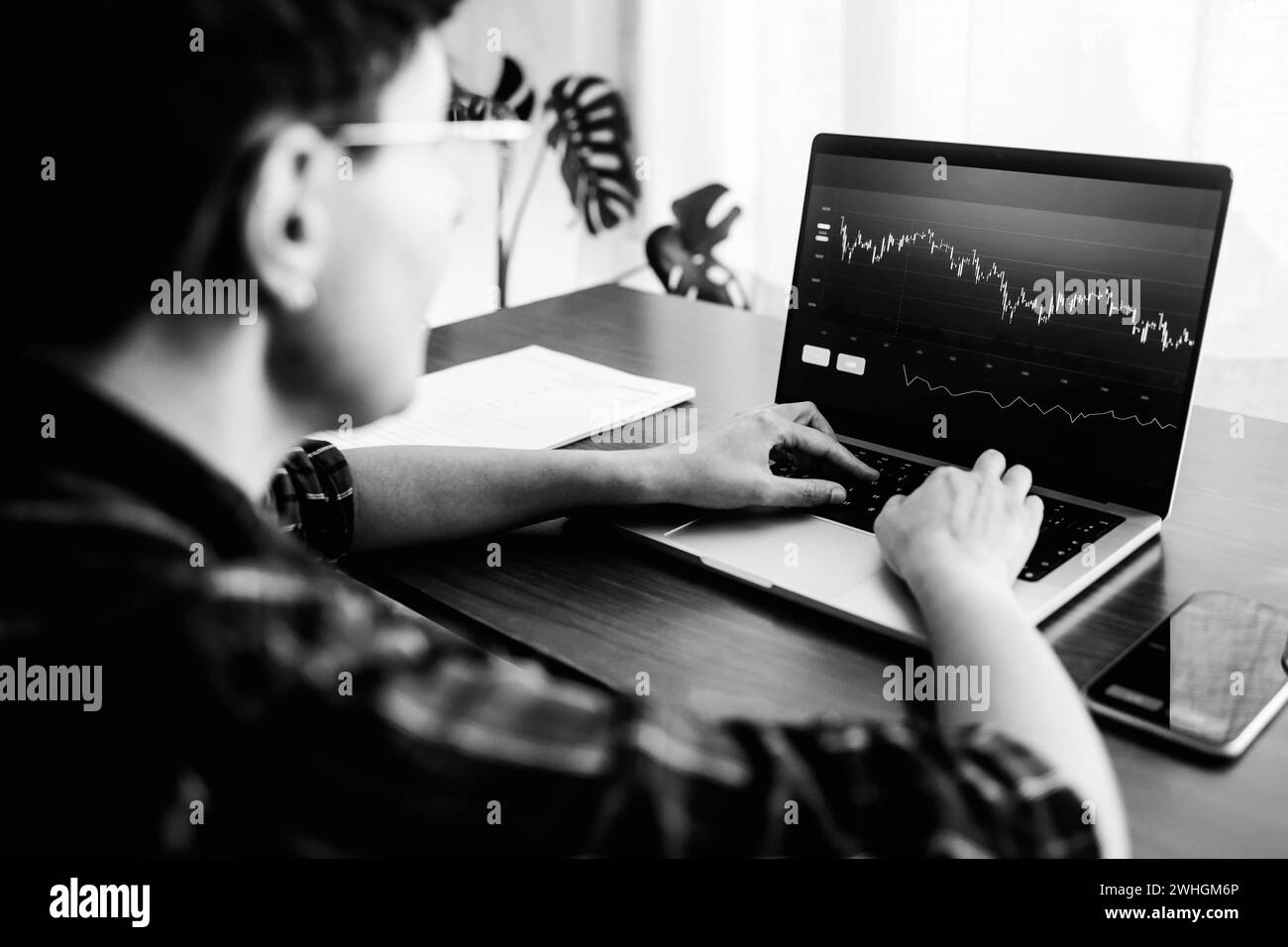 Business trader using crypto exchange app for investment and stock market analysis at hedge fund office. Finance and economy tech trend Stock Photo
