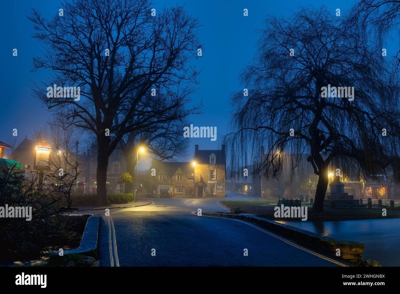 Misty dawn in February. Bourton on the Water, Cotswolds, Gloucestershire, England Stock Photo