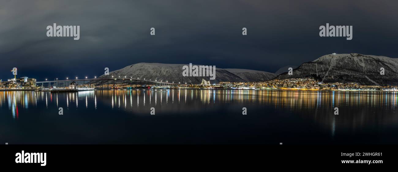 Europe, Norway, Tromso, Views across the Sound with the Tromso Bridge (Tromsøbrua) and the Arctic Cathedral (Ishavskatedralen) Stock Photo